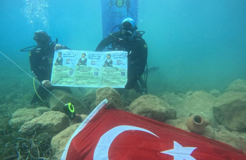 Gömeç ilçesinde, Gömeç Dalış Okulunda görevli dalgıçlar, SMA hastası Aren