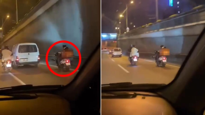 Bursa’da motosikletli kuryenin rahatlığı ‘pes’ dedirtti. Ayak ayak üzerine atarak