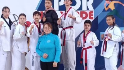  Burhaniye’de, milli sporcu Yaşarnaz Güven’in öncülüğünde çalışmalarını sürdüren gençler, Balıkesir’de